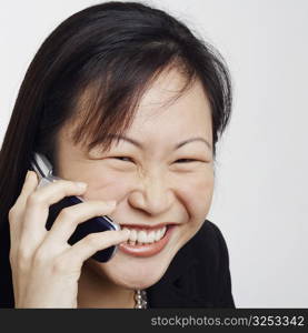 Close-up of a businesswoman talking on a mobile phone