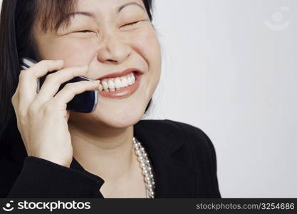 Close-up of a businesswoman talking on a mobile phone