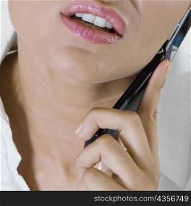 Close-up of a businesswoman talking on a mobile phone