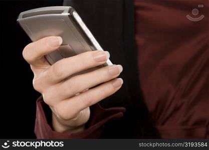 Close-up of a businesswoman text messaging