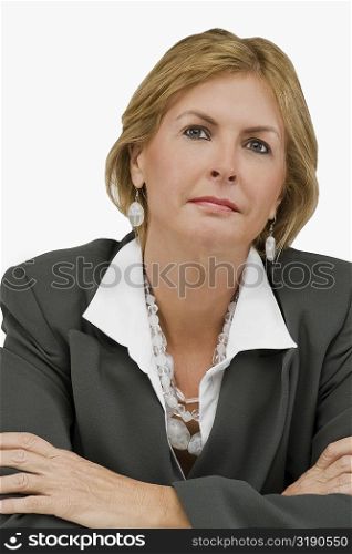 Close-up of a businesswoman thinking with her arms crossed