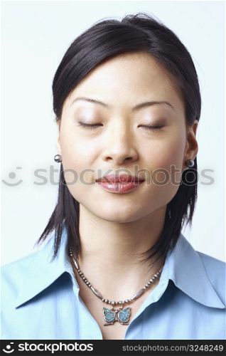 Close-up of a businesswoman thinking with her eyes closed