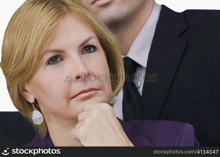 Close-up of a businesswoman thinking with her hand on her chin