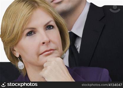 Close-up of a businesswoman thinking with her hand on her chin