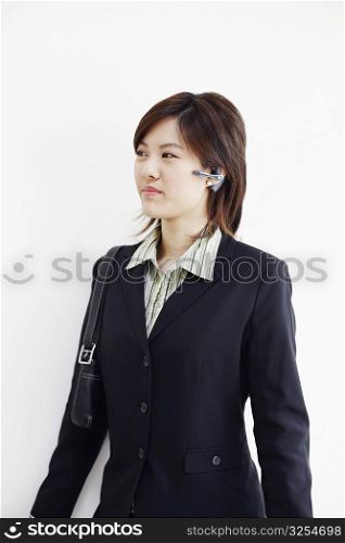 Close-up of a businesswoman using a hands free device