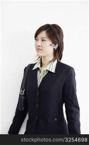 Close-up of a businesswoman using a hands free device
