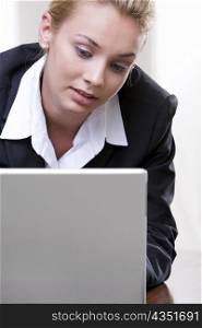 Close-up of a businesswoman using a laptop