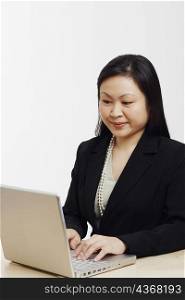 Close-up of a businesswoman using a laptop
