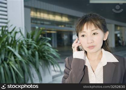 Close-up of a businesswoman using a mobile phone