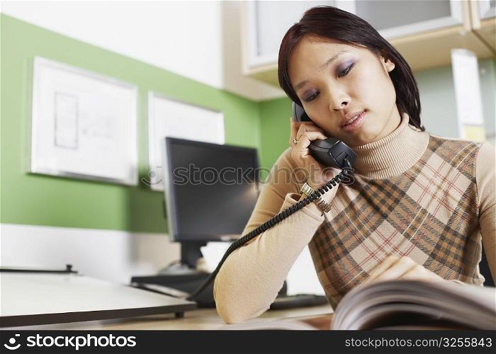 Close-up of a businesswoman using a telephone