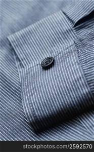 Close-up of a button on the sleeve of a shirt