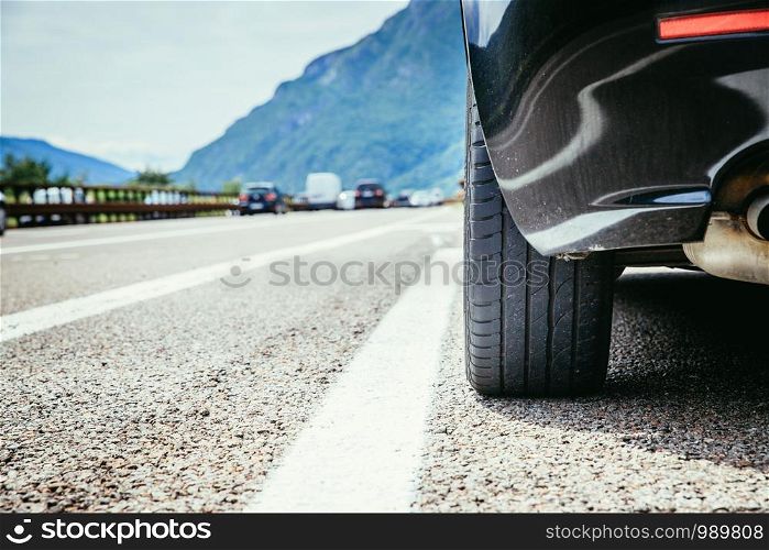 Close up of a car standing on a breakdown lane, summer vacation