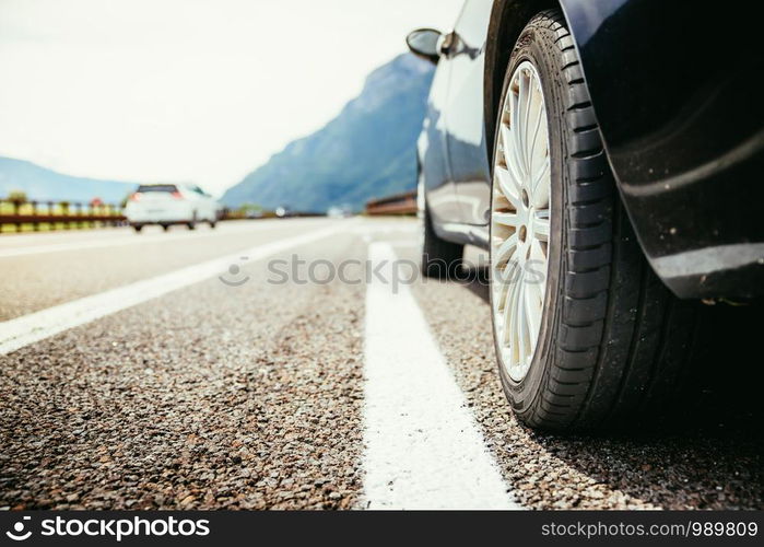 Close up of a car standing on a breakdown lane, summer vacation