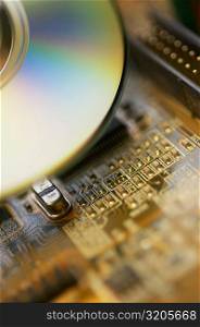 Close-up of a CD and a circuit board