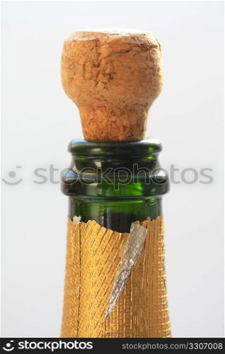 Close up of a champagne cork popping out of a bottle