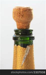 Close up of a champagne cork popping out of a bottle