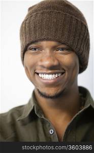 Close-up of a cheerful African American man wearing knit hat