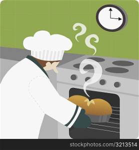Close-up of a chef baking food in an oven