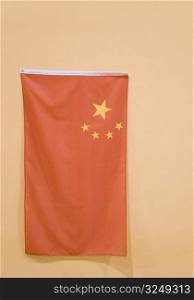 Close-up of a Chinese flag hanging on the wall