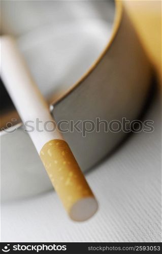 Close-up of a cigarette in an ashtray