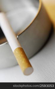 Close-up of a cigarette in an ashtray