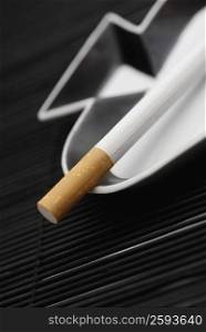 Close-up of a cigarette on an ashtray