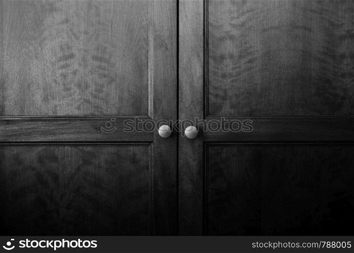 Close up of a closed wooden door brown design background texture vintage interior beauty black and white. Close up of a closed wooden door brown design background texture vintage interior black and white