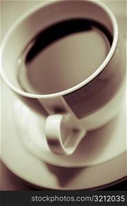Close-up of a coffee cup with a saucer