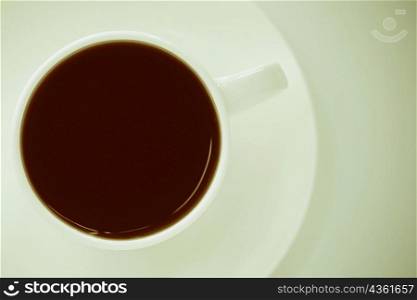Close-up of a coffee cup with a saucer