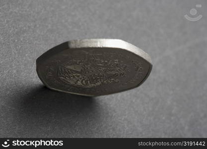 Close-up of a coin standing