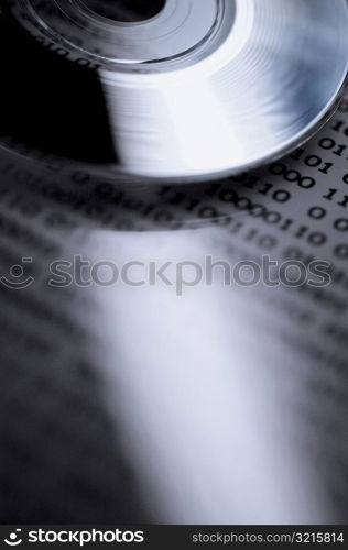 Close-up of a compact disc on a document