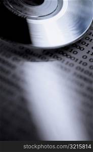 Close-up of a compact disc on a document