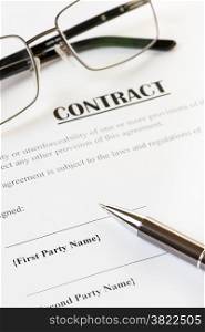 Close up of a contract ready to be signed.With pen and glasses.Office,legal concept.