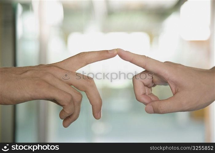 Close-up of a couple&acute;s fingers touching each other