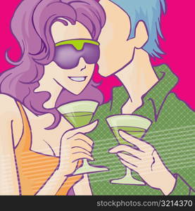 Close-up of a couple holding wine glasses