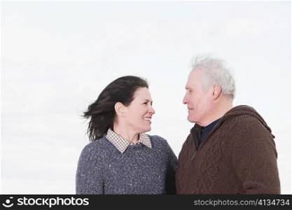 Close-up of a couple looking at each other and smiling