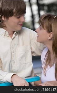 Close-up of a couple smiling at each other