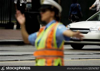 Close-up of a crossing guard directing traffic, Chicago, Illinois, USA