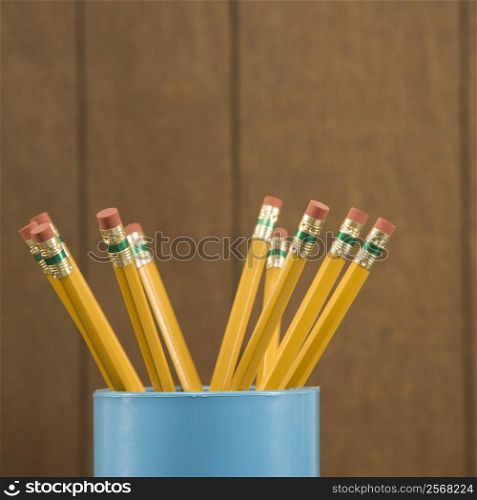 Close-up of a cup filled with wooden pencils.