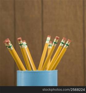 Close-up of a cup filled with wooden pencils.