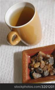 Close-up of a cup of herbal tea and herbal medicine