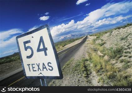 Close-up of a distance sign on the roadside, Texas, USA