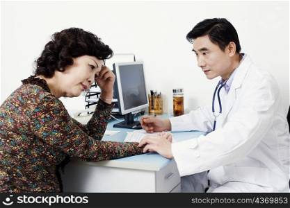 Close-up of a doctor examining a female patient