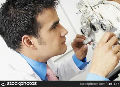 Close-up of a doctor looking through a phoropter