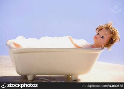 Close-up of a doll in a bathtub