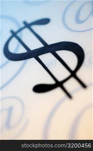 Close-up of a dollar sign with an &acute;at&acute; symbols