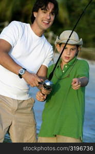 Close-up of a father and his son fishing