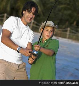 Close-up of a father and his son fishing