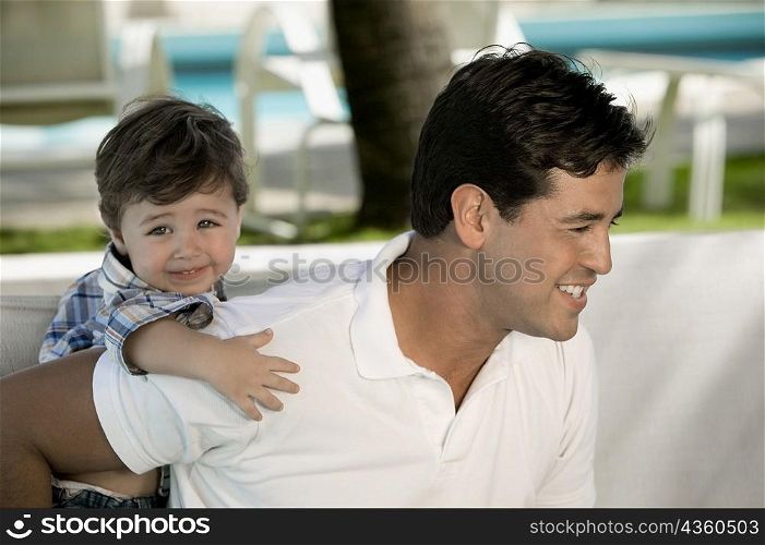 Close-up of a father with his son smiling