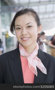 Close-up of a female cabin crew smiling